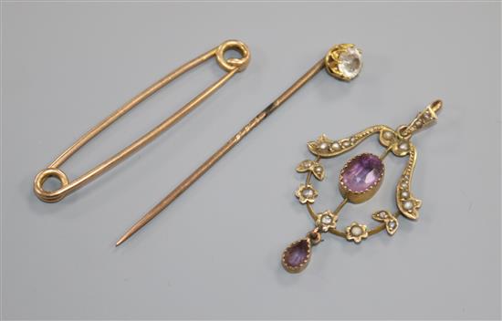A late Victorian 9ct amethyst and seed pearl pendant and two yellow metal pins.